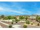Neighborhood view of the lush community featuring walking paths and mature trees at 3448 Quiet Pueblo St, North Las Vegas, NV 89032