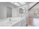 Open bathroom featuring dual sinks, tile flooring, with views into the Primary and other rooms at 3594 Wild Cherry Ct, Las Vegas, NV 89121