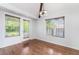Bright dining room with hardwood floors, dual windows, and access to the backyard at 3594 Wild Cherry Ct, Las Vegas, NV 89121