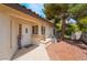 Welcoming front entrance with a cozy porch, complemented by a colorful welcome sign and well-kept landscaping at 3594 Wild Cherry Ct, Las Vegas, NV 89121