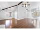 Spacious living room with hardwood floors, vaulted ceilings, and modern chandelier lighting at 3594 Wild Cherry Ct, Las Vegas, NV 89121