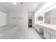 Main bathroom featuring a soaking tub, double vanity, and plenty of storage at 3594 Wild Cherry Ct, Las Vegas, NV 89121