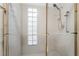 Contemporary shower design with glass block window and chrome fixtures at 3594 Wild Cherry Ct, Las Vegas, NV 89121