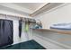 Bright walk-in closet with ample storage and well-organized hanging racks at 3594 Wild Cherry Ct, Las Vegas, NV 89121