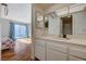 Bathroom vanity and mirror view, with a bedroom and patio access visible at 3642 Haverhill St, Las Vegas, NV 89121