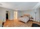 Bedroom with wood-look flooring, a bed, closet and access to ensuite bathroom at 3642 Haverhill St, Las Vegas, NV 89121
