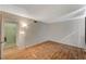 A simple bedroom featuring wood floors, neutral walls, and closet at 3642 Haverhill St, Las Vegas, NV 89121