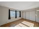 Bright bedroom featuring natural light, wood floors, and a spacious closet at 3642 Haverhill St, Las Vegas, NV 89121