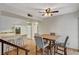 Dining area featuring hardwood floors, a ceiling fan, and bar seating by the kitchen with modern appliances at 3642 Haverhill St, Las Vegas, NV 89121
