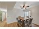 This dining area features wood floors, a ceiling fan, and sliding doors to the outside at 3642 Haverhill St, Las Vegas, NV 89121