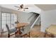 The dining area offers stairs to the second floor, wood floors, and a ceiling fan at 3642 Haverhill St, Las Vegas, NV 89121