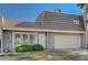 Charming townhome featuring a two-car garage, secure front door, and verdant landscaping, situated on a sunny day at 3642 Haverhill St, Las Vegas, NV 89121