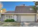 Charming townhome featuring a two-car garage, secure front door, and verdant landscaping, situated on a sunny day at 3642 Haverhill St, Las Vegas, NV 89121