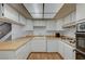 This kitchen has white cabinets, a wood countertop, and stainless steel appliances at 3642 Haverhill St, Las Vegas, NV 89121