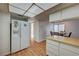 The kitchen has white cabinets, a refrigerator, and views of the dining area at 3642 Haverhill St, Las Vegas, NV 89121