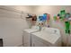 The laundry room features a washer, dryer, and shelving for storage and supplies at 3642 Haverhill St, Las Vegas, NV 89121