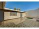 Private outdoor patio features decorative tile, garden access, and mature trees in a well-maintained landscape at 3642 Haverhill St, Las Vegas, NV 89121