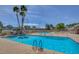 Enjoy community amenities with a pristine pool and lounge area, surrounded by manicured grounds at 3642 Haverhill St, Las Vegas, NV 89121