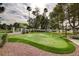 Community putting green showcasing manicured lawns and mature trees, providing a relaxing outdoor amenity at 3642 Haverhill St, Las Vegas, NV 89121