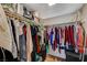 Walk-in closet with shelving and rods for hanging clothes, bags and shoes at 3642 Haverhill St, Las Vegas, NV 89121