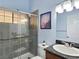 Modern bathroom features a stylish glass-enclosed shower, sleek fixtures, and accessibility features at 3780 Shawnee Ave, Pahrump, NV 89048