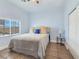 Cozy bedroom featuring natural light, a ceiling fan, neutral color palette, and tile flooring at 3780 Shawnee Ave, Pahrump, NV 89048
