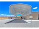 Large metal carport provides ample covered parking space adjacent to the home at 3780 Shawnee Ave, Pahrump, NV 89048