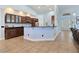 Spacious kitchen features a large island with granite countertops, stainless steel appliances, and ample cabinetry at 3780 Shawnee Ave, Pahrump, NV 89048