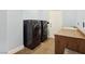 Convenient laundry room featuring modern washer and dryer units, plus storage at 3780 Shawnee Ave, Pahrump, NV 89048