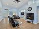 Open-concept living room featuring a fireplace, comfortable seating, and open access to the entryway at 3780 Shawnee Ave, Pahrump, NV 89048