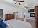 Bright main bedroom suite featuring a fireplace, sitting area, and beautiful decor at 3780 Shawnee Ave, Pahrump, NV 89048