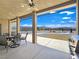 Scenic outdoor patio with a dining set and a beautiful view of the landscaped backyard at 3780 Shawnee Ave, Pahrump, NV 89048