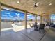 Inviting covered patio with dining set, ceiling fans, and mountain views at 3780 Shawnee Ave, Pahrump, NV 89048