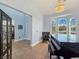 A piano room featuring elegant natural light, a chandelier, and an archway to the entryway at 3780 Shawnee Ave, Pahrump, NV 89048