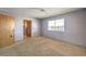 Bright bedroom with a large window and closet space at 403 Woodridge Dr, Henderson, NV 89015
