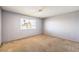 Neutral bedroom featuring a large window providing lots of natural light at 403 Woodridge Dr, Henderson, NV 89015