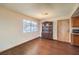 Dining area featuring hardwood floors, a large window, and an antique hutch at 403 Woodridge Dr, Henderson, NV 89015