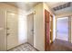 Welcoming entryway with tile flooring, a storage cabinet, and doorways leading to other rooms at 403 Woodridge Dr, Henderson, NV 89015