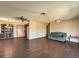 Spacious living room with updated flooring and ceiling fan at 403 Woodridge Dr, Henderson, NV 89015