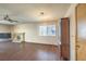 Living room featuring a fireplace, window, and updated flooring at 403 Woodridge Dr, Henderson, NV 89015
