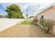 A backyard with artificial turf, privacy wall and low-maintenance desert landscaping at 434 Viewmont Dr, Henderson, NV 89015