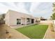 Wide view of the backyard with artificial turf and patio at 434 Viewmont Dr, Henderson, NV 89015
