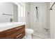 Modern bathroom showcasing a floating vanity and a walk-in shower with decorative tile at 434 Viewmont Dr, Henderson, NV 89015