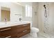 A modern bathroom featuring a floating vanity and a tiled walk-in shower at 434 Viewmont Dr, Henderson, NV 89015