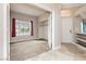 An empty bedroom space showcasing natural light from a large window at 434 Viewmont Dr, Henderson, NV 89015