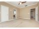 A Primary bedroom featuring neutral tones, plush carpeting, and three entry doors at 434 Viewmont Dr, Henderson, NV 89015
