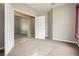 This bedroom features neutral walls, carpeted floors, and an open doorway to another room at 434 Viewmont Dr, Henderson, NV 89015