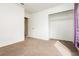 This bedroom features neutral walls, carpeted floors, and an open closet at 434 Viewmont Dr, Henderson, NV 89015