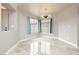 Dining area with tile floors, modern light fixture, and large windows at 434 Viewmont Dr, Henderson, NV 89015
