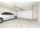 Spacious two-car garage with a silver car parked inside at 434 Viewmont Dr, Henderson, NV 89015